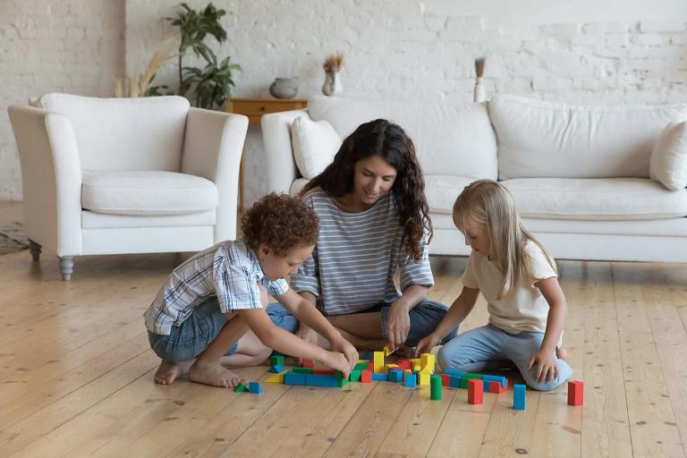 Two kids and an adult playing